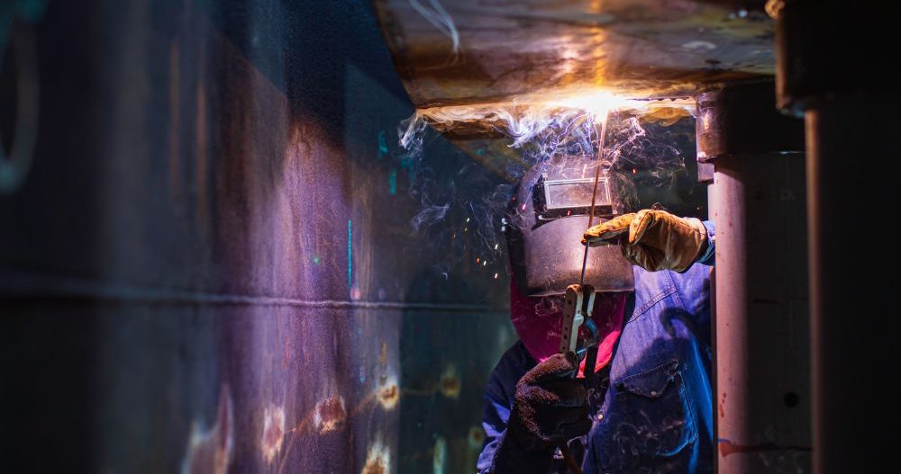 Welder Working In Confined Space